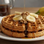 Golden, crispy banana waffles with maple syrup